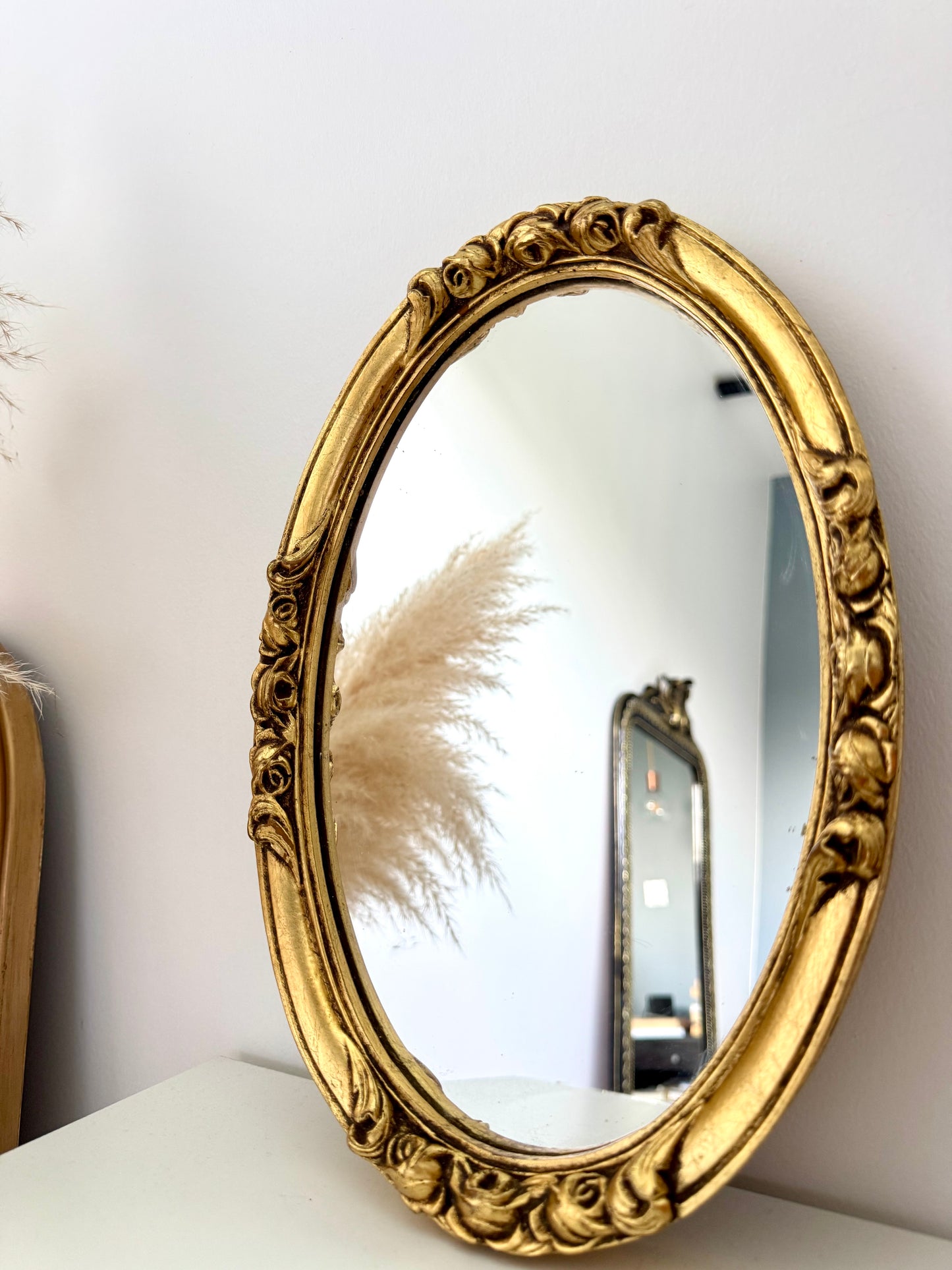 Petit miroir ovale doré