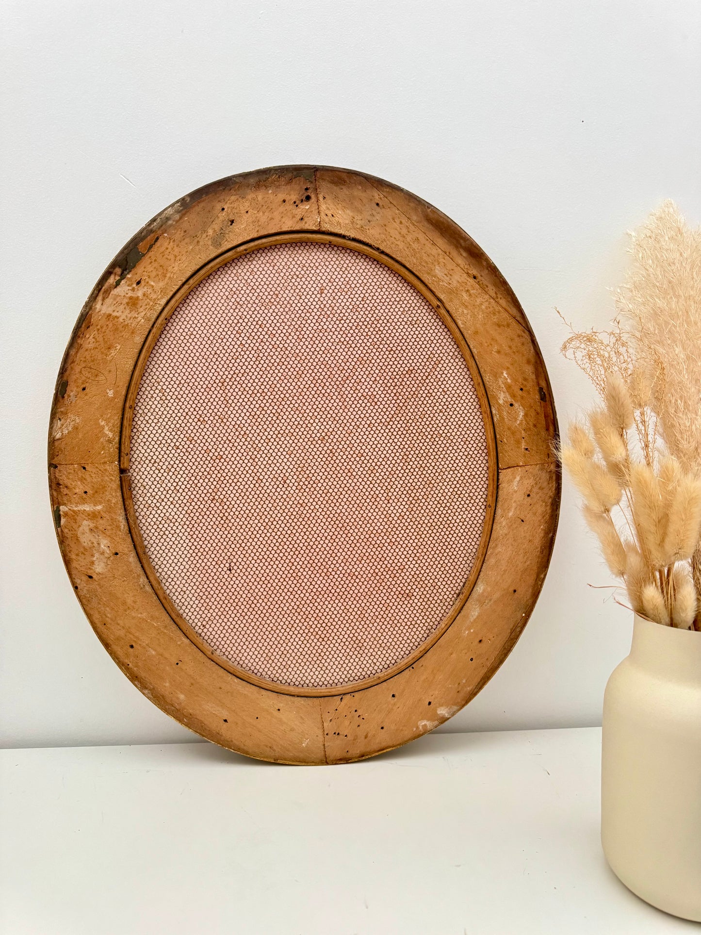 Miroir ancien ovale doré à la feuille d’or