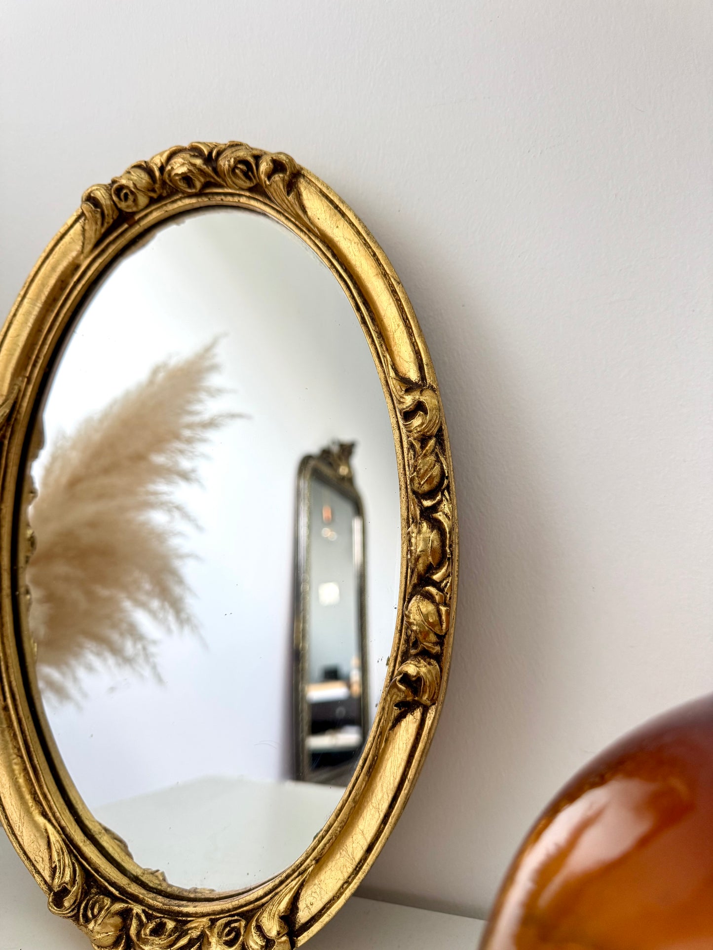 Petit miroir ovale doré