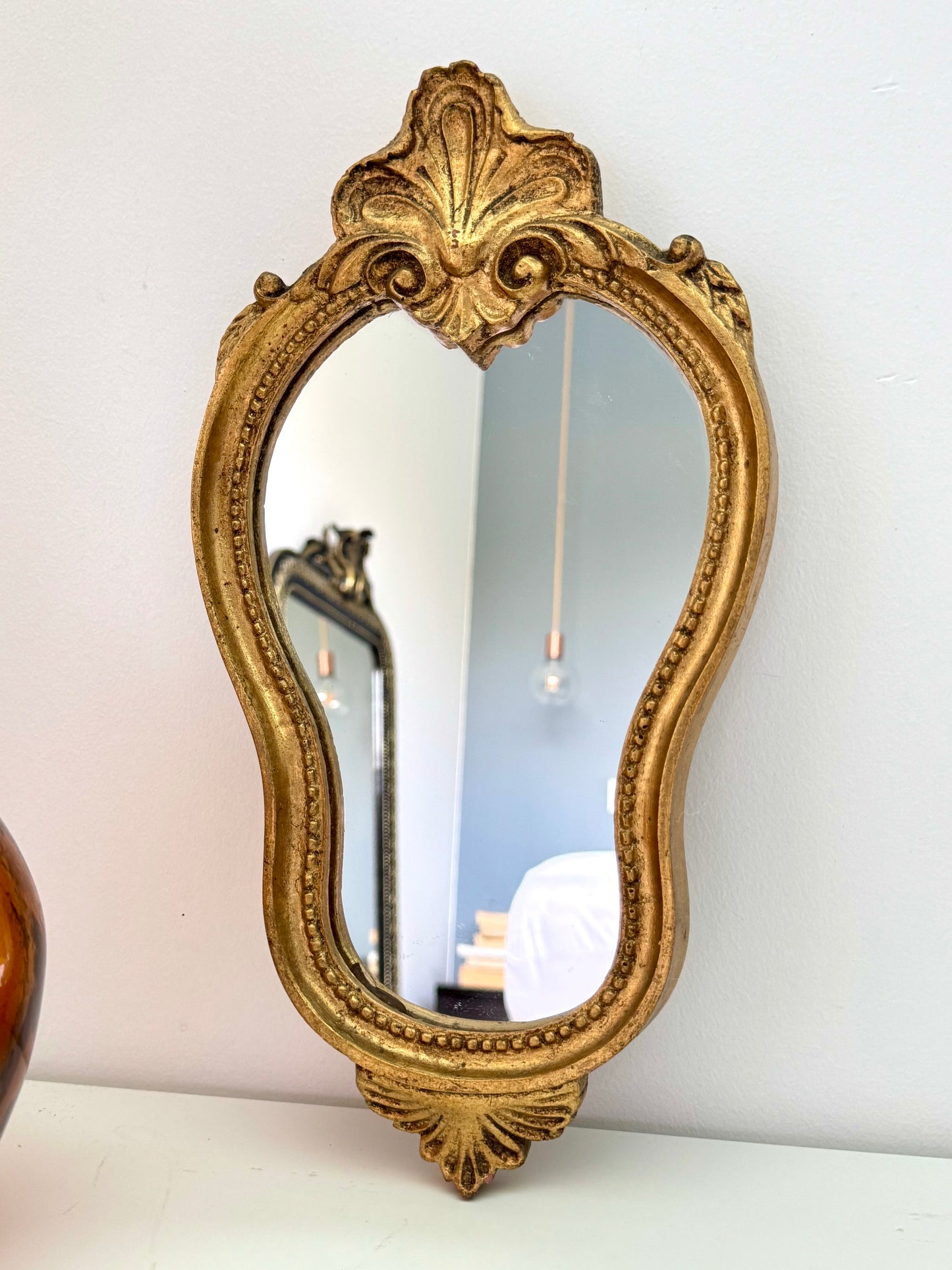 Miroir doré de style baroque