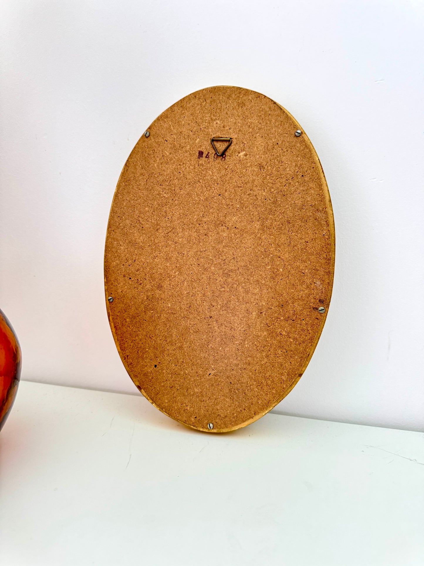 Petit miroir ovale doré