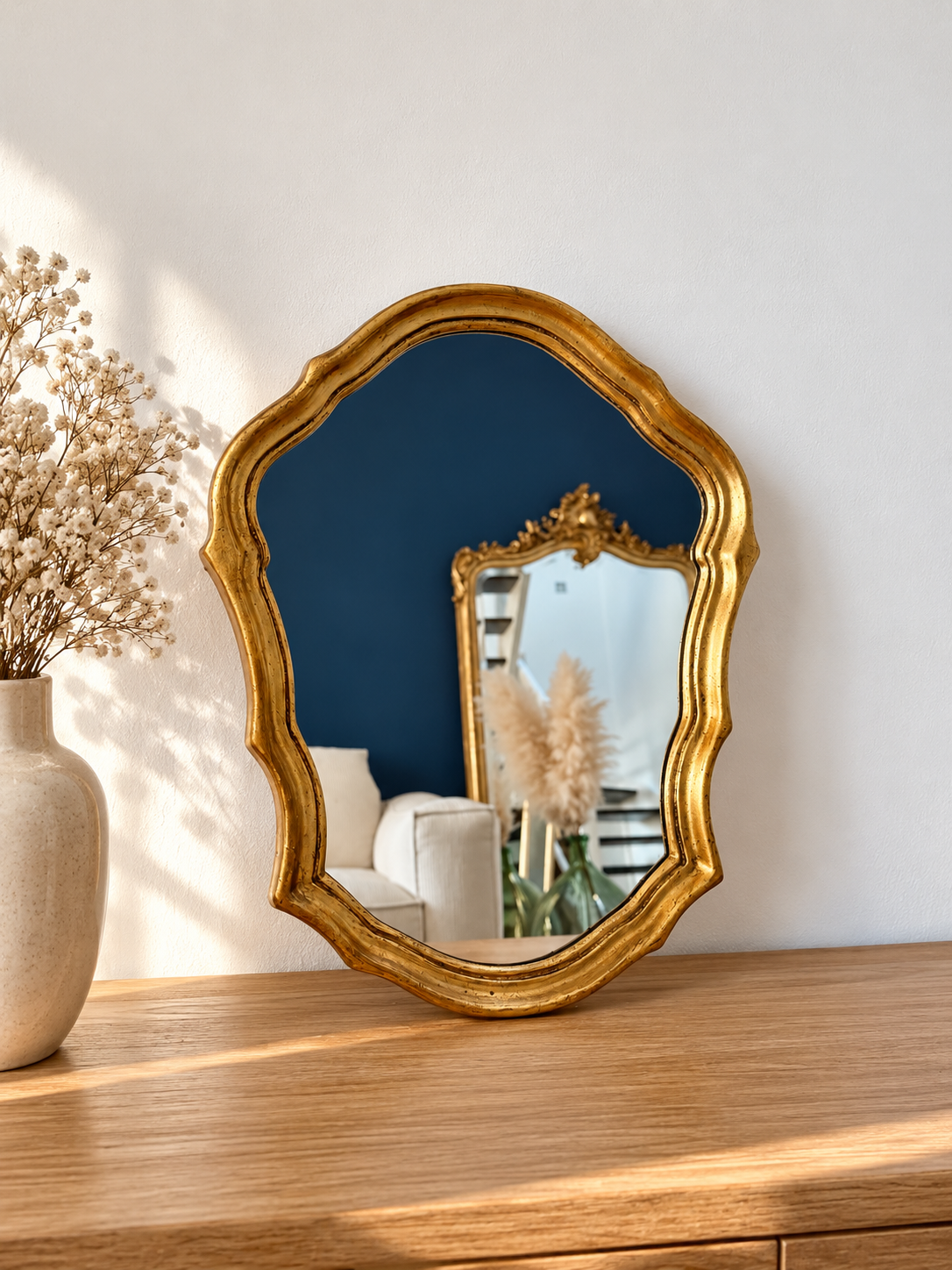 Miroir ancien doré de style baroque
