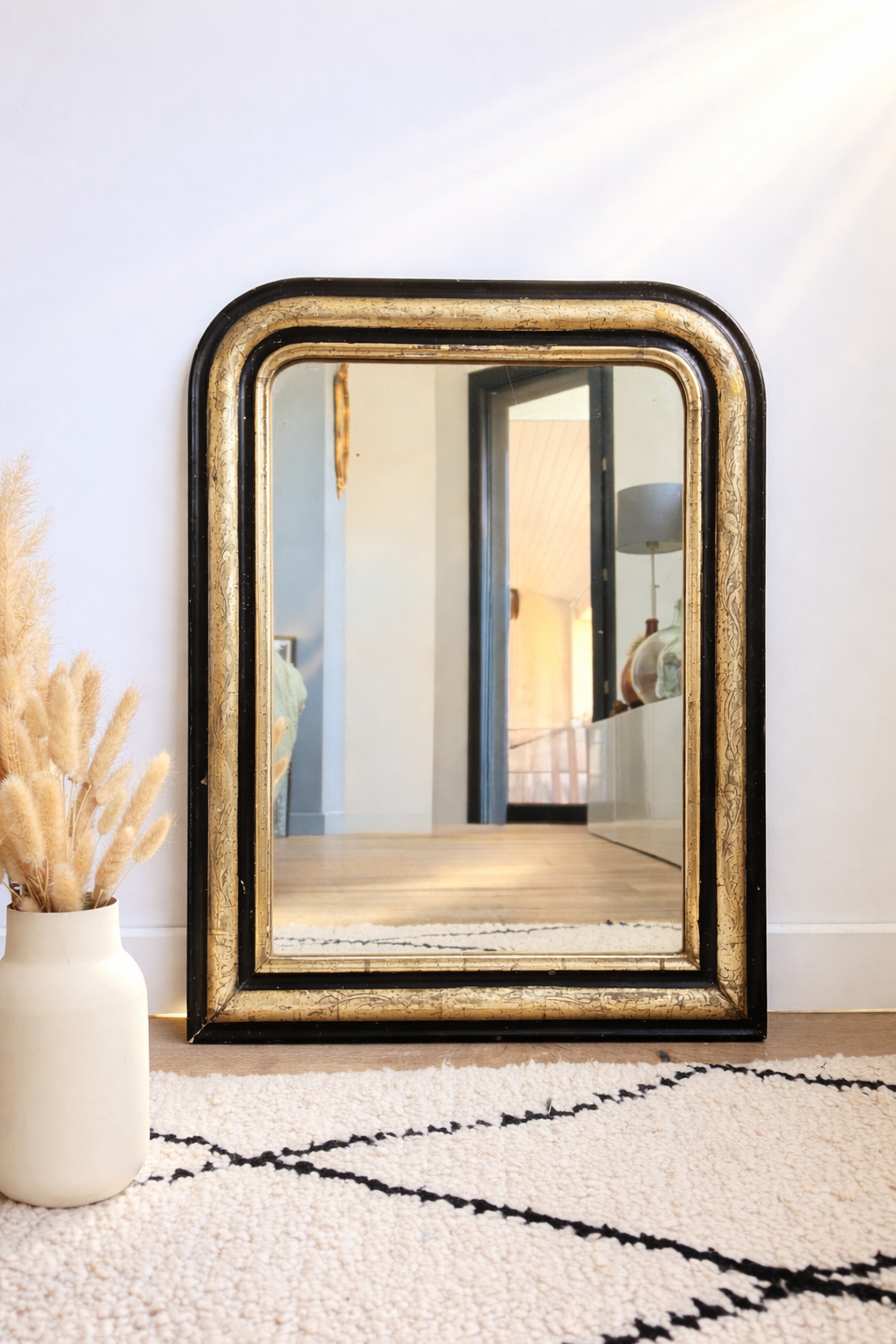 Miroir ancien Louis Philippe doré à la feuille d’or et noir