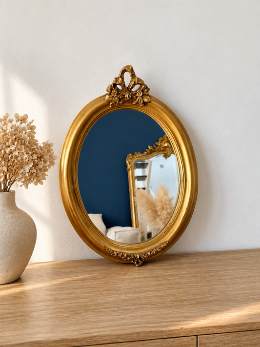 Miroir ancien doré à fronton