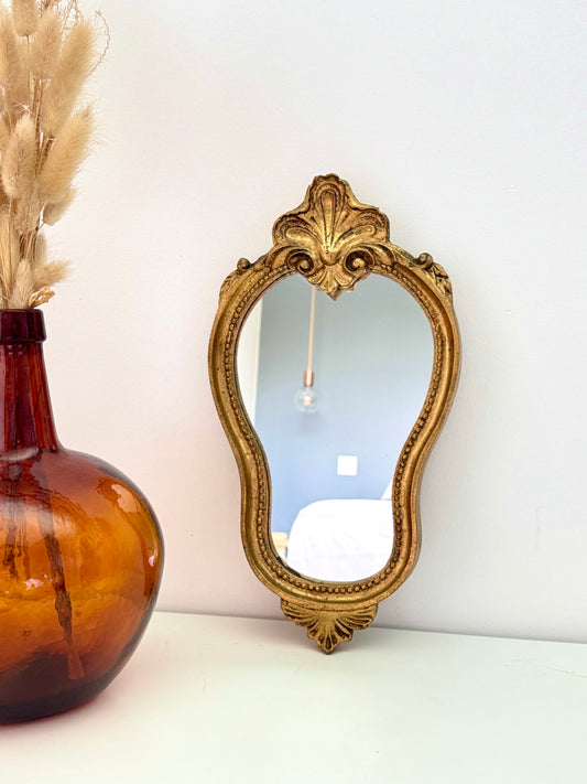 Miroir doré de style baroque