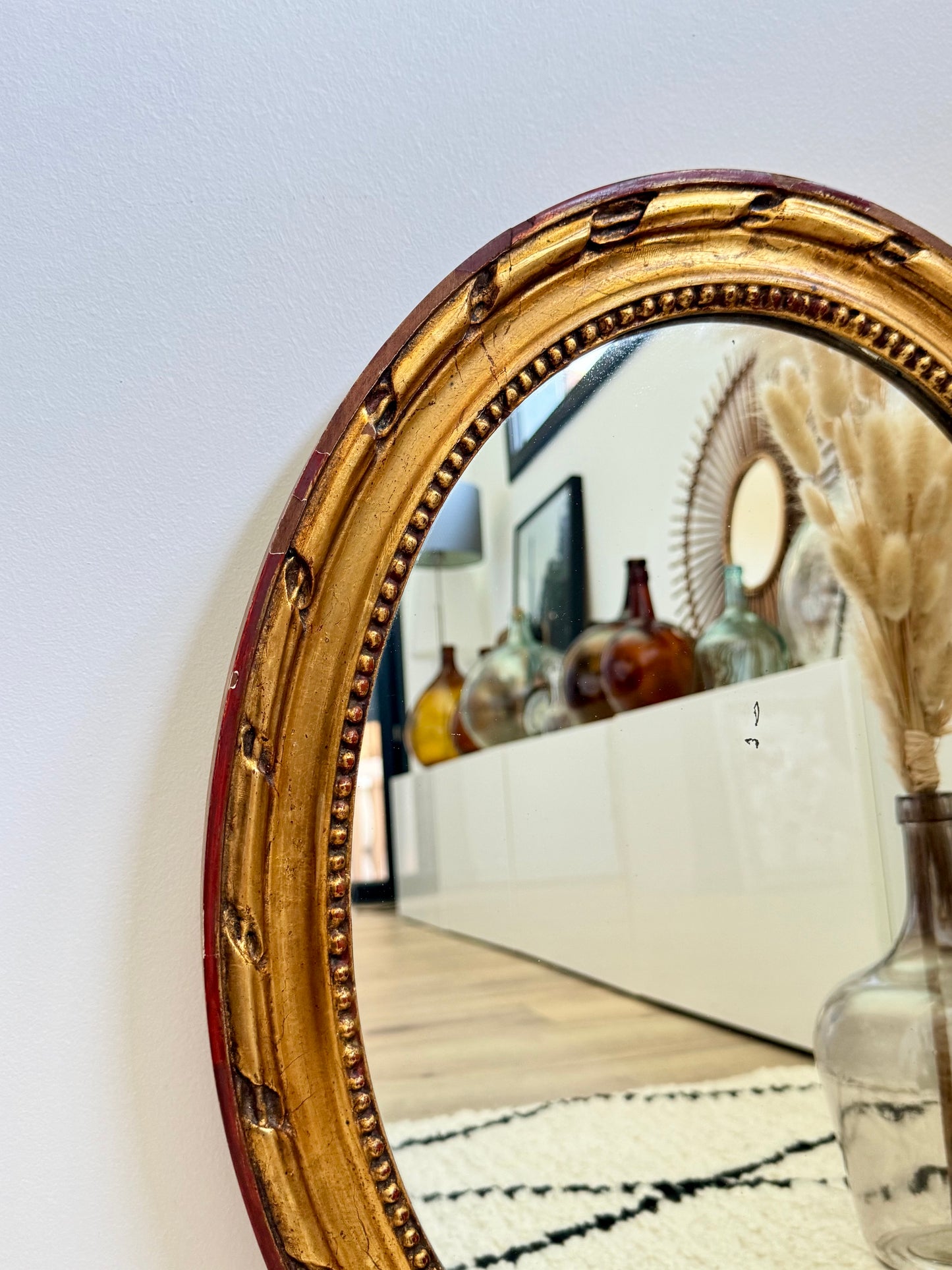 Miroir ancien doré de forme ovale