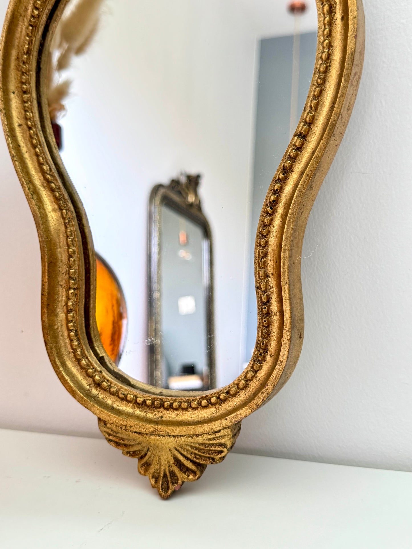 Miroir doré de style baroque