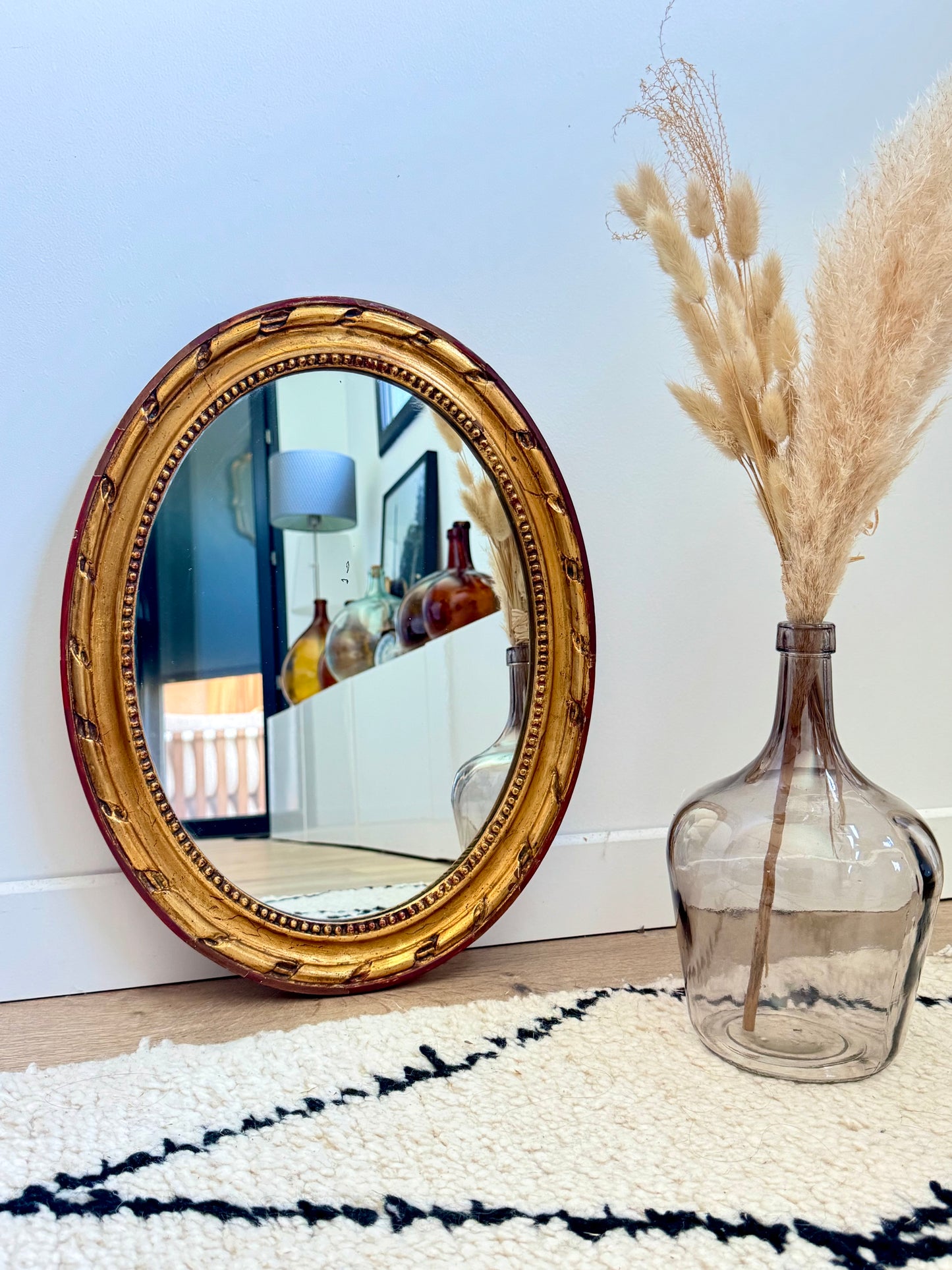 Miroir ancien doré de forme ovale