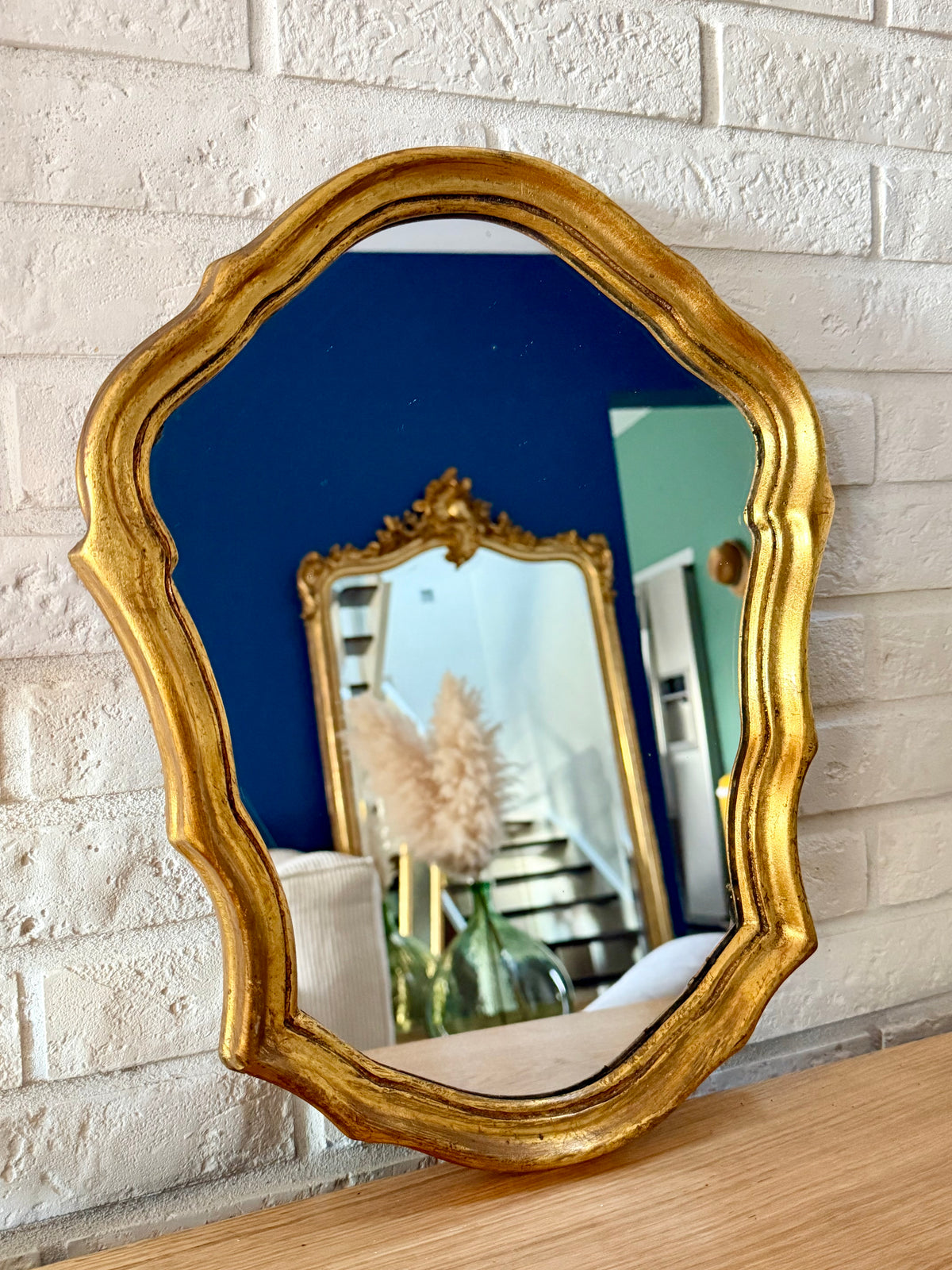 Miroir ancien doré de style baroque