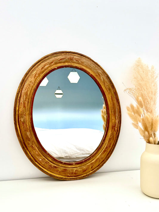 Miroir ancien ovale doré à la feuille d’or