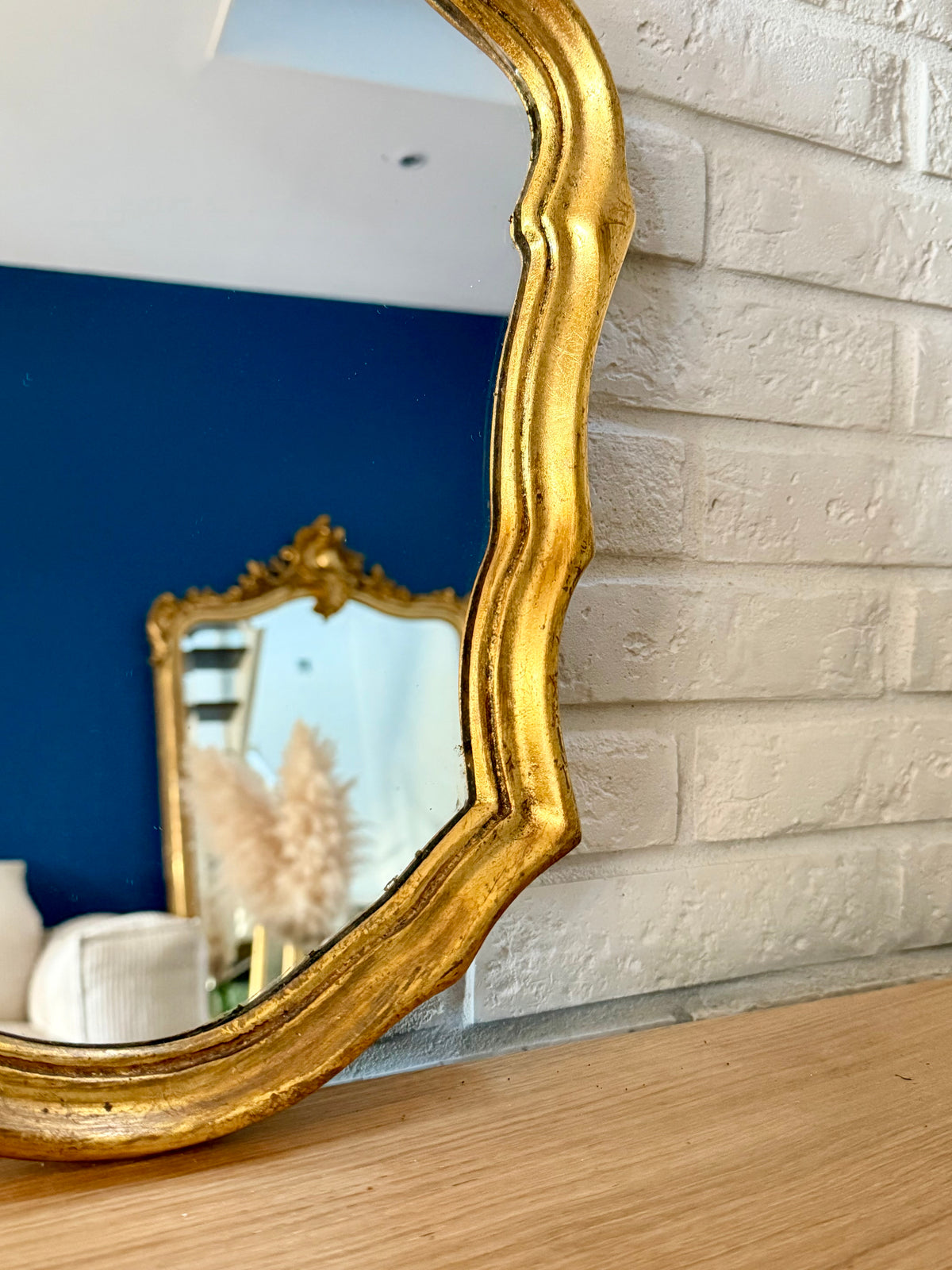 Miroir ancien doré de style baroque