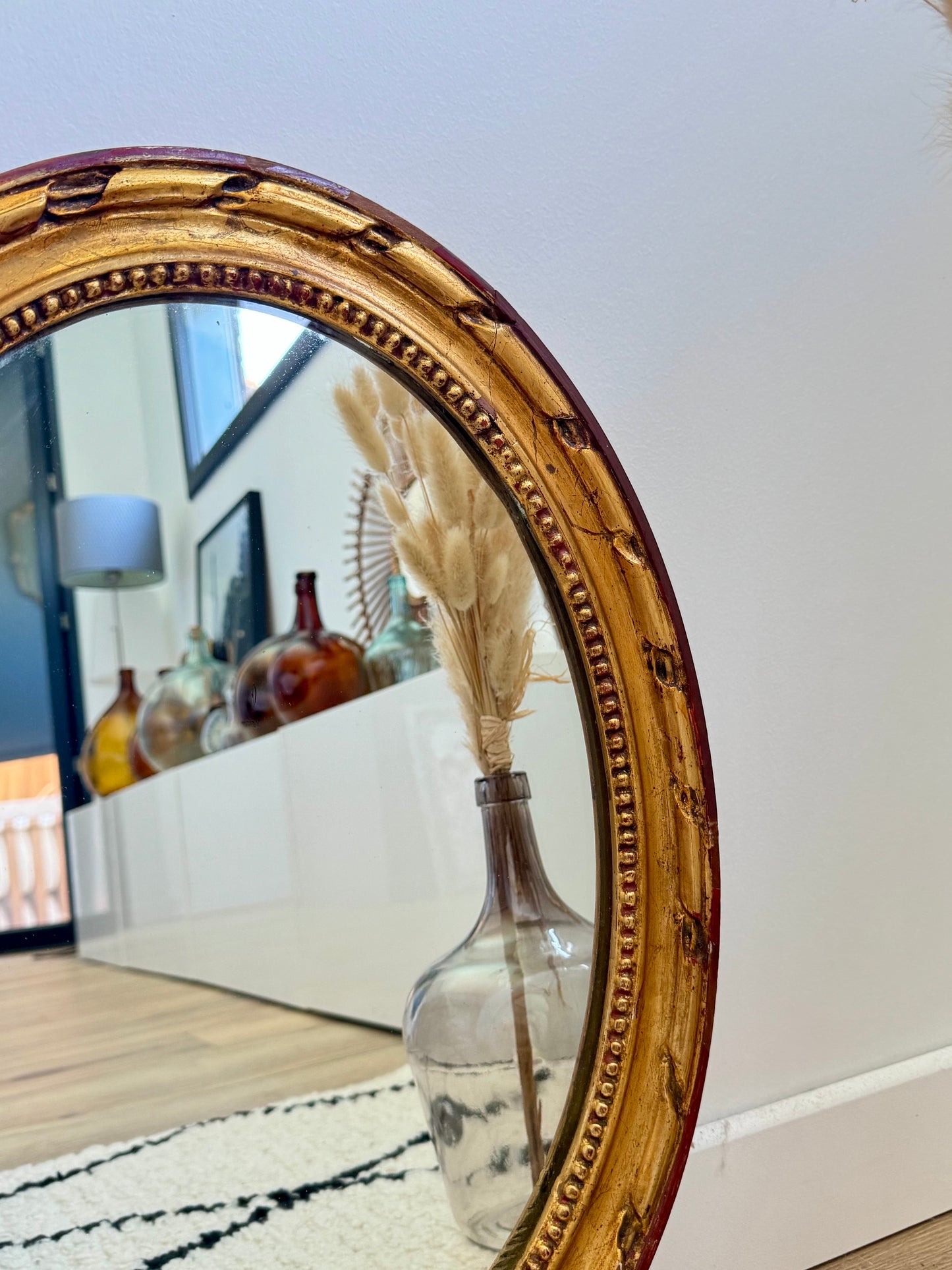 Miroir ancien doré de forme ovale