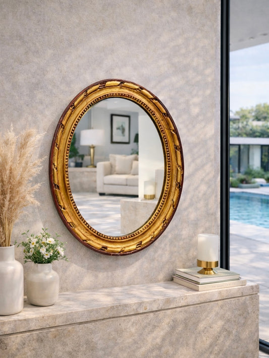 Miroir ancien doré de forme ovale