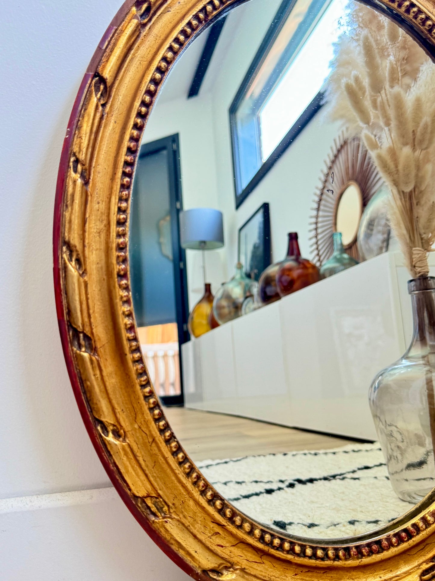 Miroir ancien doré de forme ovale