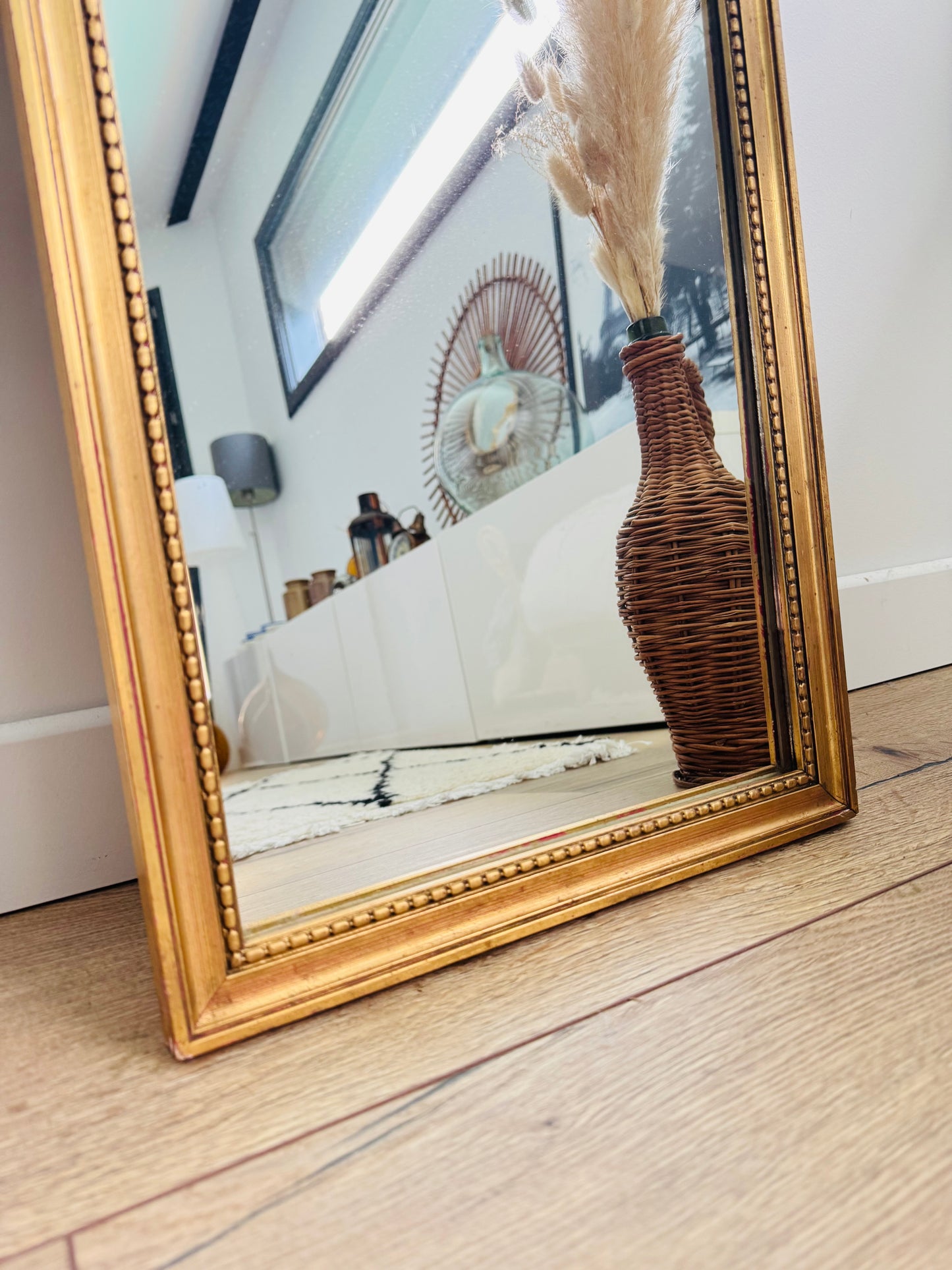 Miroir ancien doré au style classique