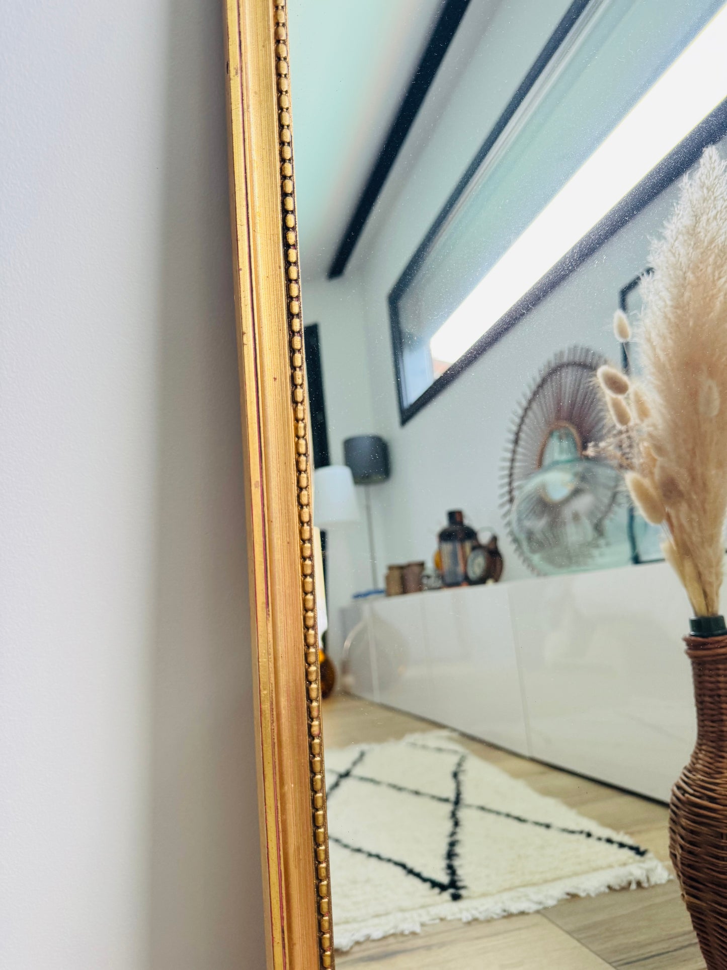 Miroir ancien doré au style classique
