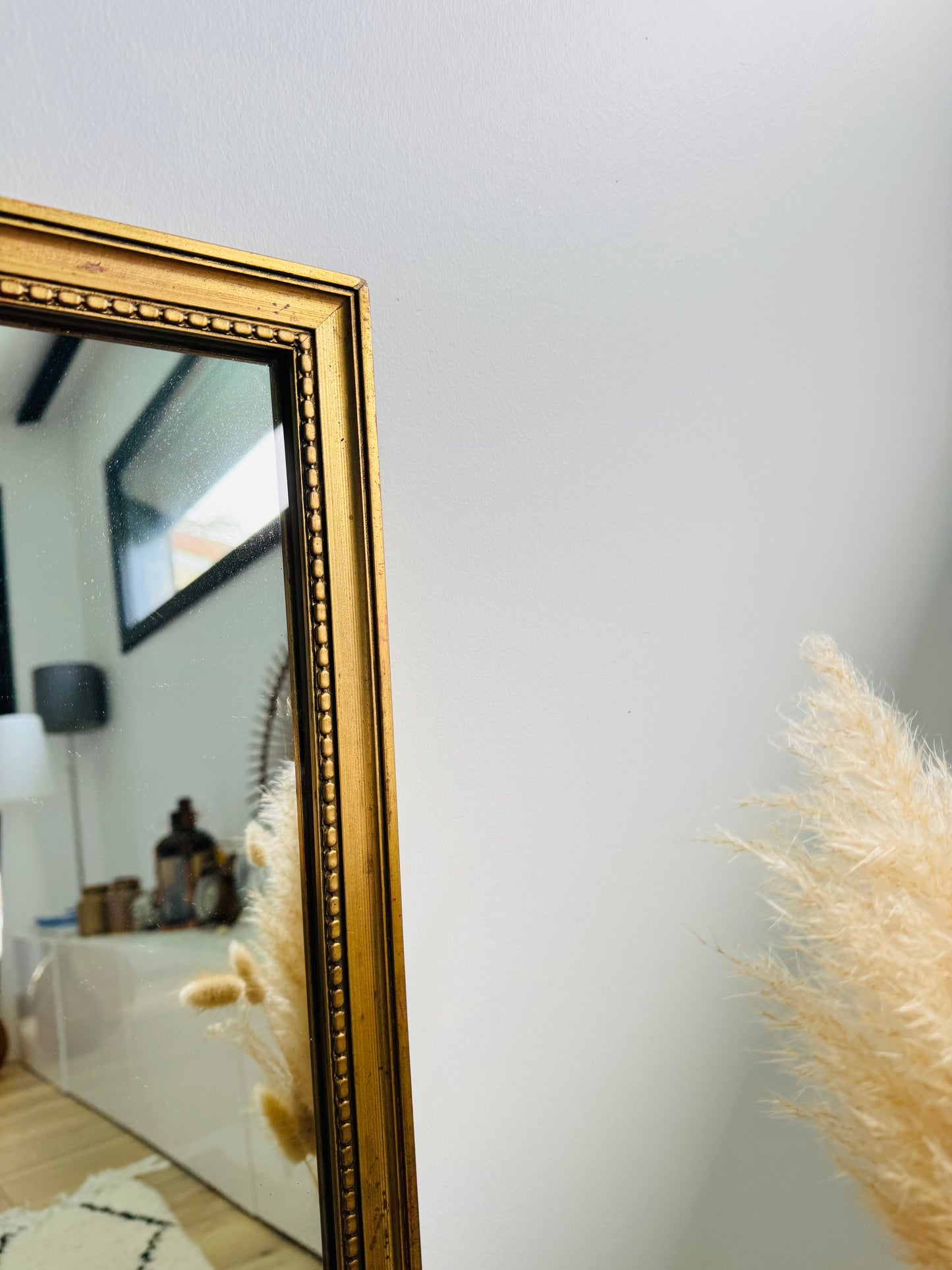 Miroir ancien doré au style classique