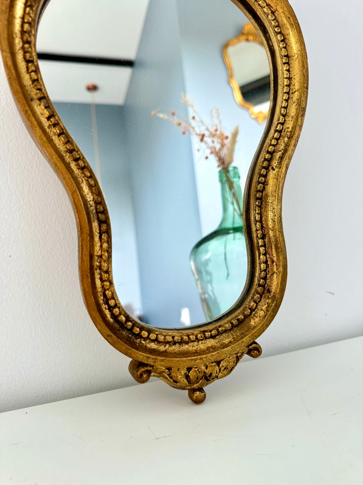 Miroir ancien doré de style baroque