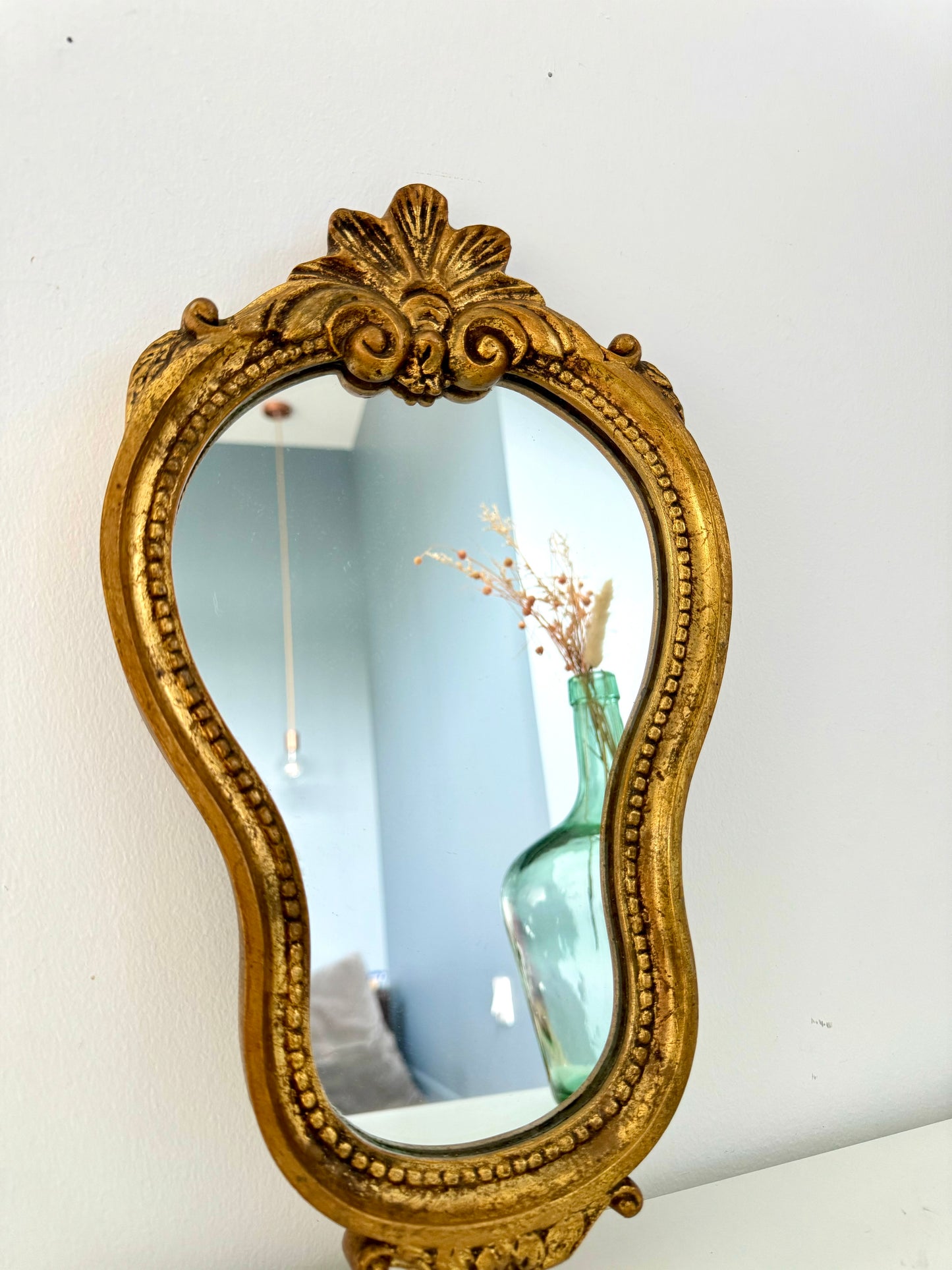 Miroir ancien doré de style baroque